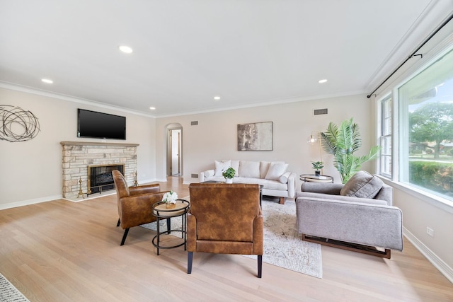 9210 S Mozart Ave, Evergreen Park, IL 60805 - living area with ornamental molding, a stone fireplace, recessed lighting, and light wood finished floors