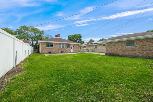 9210 S Mozart Ave, Evergreen Park, IL 60805 - rear view of property with brick siding, a chimney, and a patio