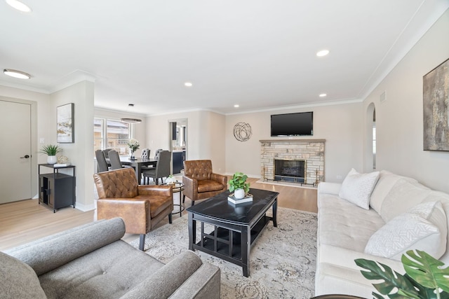 9210 S Mozart Ave, Evergreen Park, IL 60805 - living area featuring light wood finished floors, recessed lighting, arched walkways, crown molding, and a fireplace