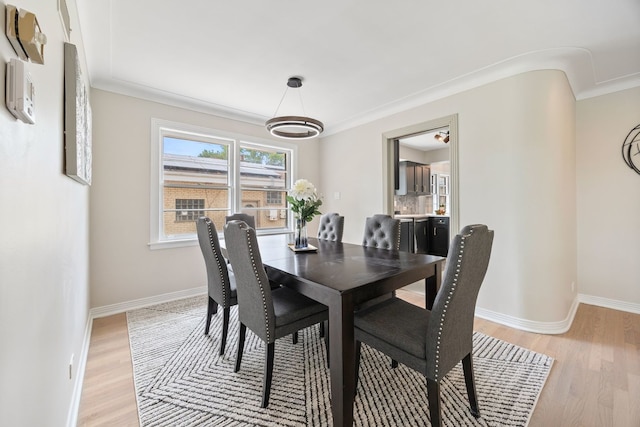 9210 S Mozart Ave, Evergreen Park, IL 60805 - dining room with light wood finished floors and baseboards