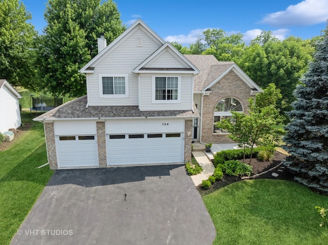 134 S Hankes Rd, Aurora, IL 60506 - traditional-style home with brick siding, a chimney, a front yard, and a shingled roof
