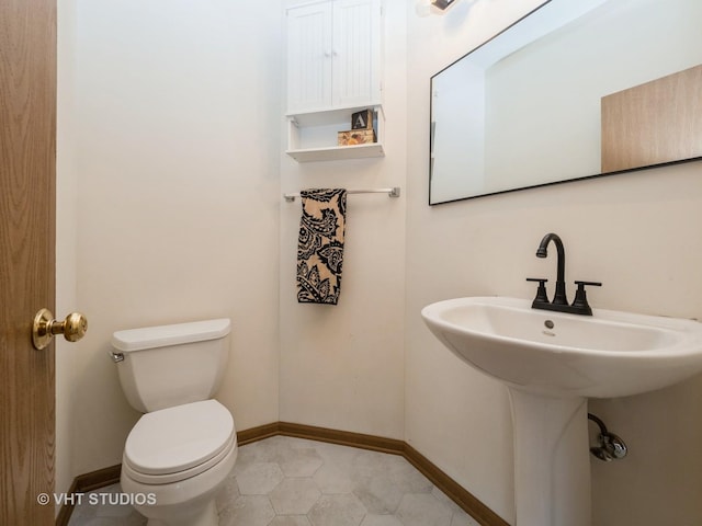 134 S Hankes Rd, Aurora, IL 60506 - bathroom featuring toilet and baseboards