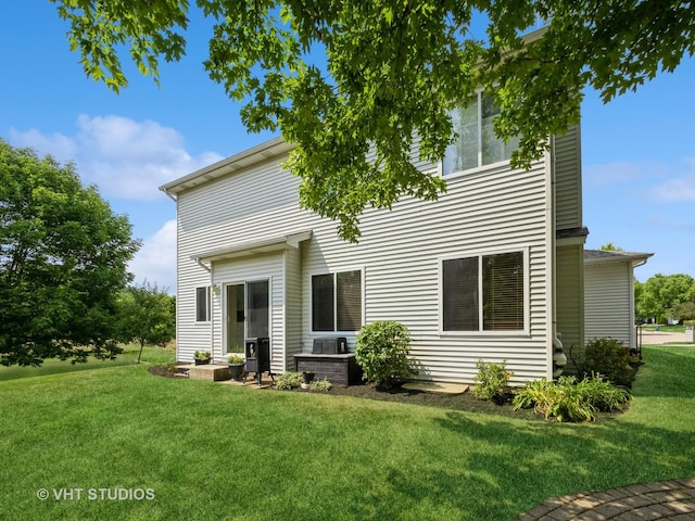 134 S Hankes Rd, Aurora, IL 60506 - back of property featuring a lawn