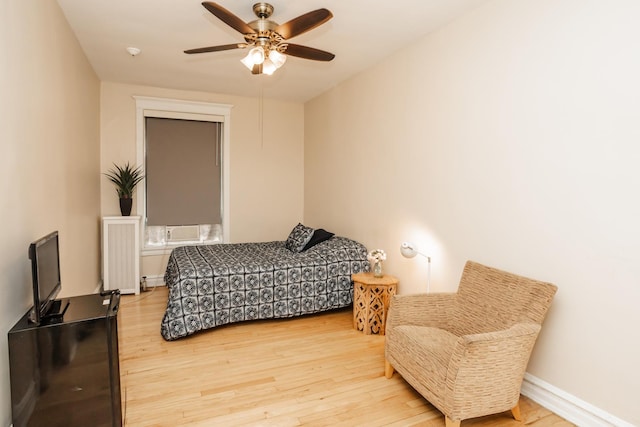 5142 S Greenwood Ave Unit 1, Chicago, IL 60615 - bedroom with wood finished floors, ceiling fan, and radiator
