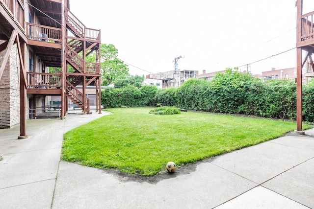 5142 S Greenwood Ave Unit 1, Chicago, IL 60615 - view of grassy yard featuring stairway and a deck