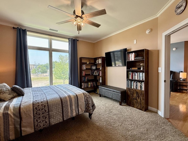160 S River St Unit 204, Aurora, IL 60506 - carpeted bedroom with ornamental molding and ceiling fan