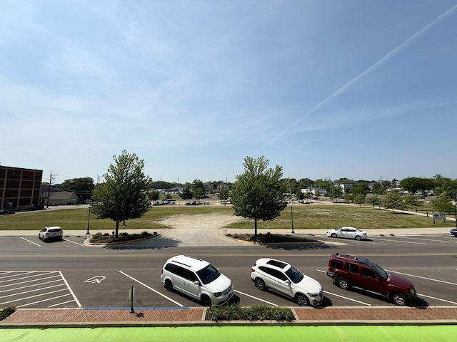 160 S River St Unit 204, Aurora, IL 60506 - view of asphalt road featuring curbs and sidewalks