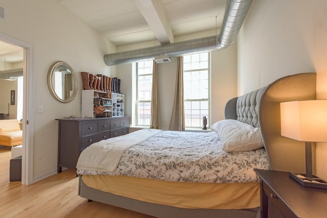 1919 S Michigan Ave Unit 412, Chicago, IL 60616 - bedroom featuring light wood finished floors and beam ceiling