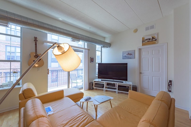 1919 S Michigan Ave Unit 412, Chicago, IL 60616 - living room with plenty of natural light, wood finished floors, and a textured ceiling