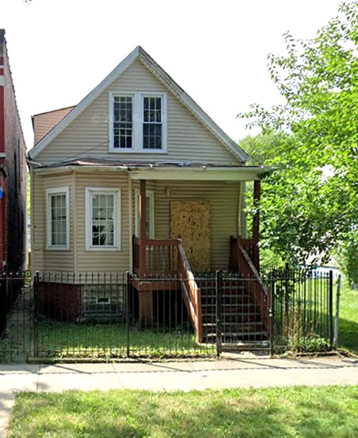 5922 S Paulina St, Chicago, IL 60636 - bungalow-style house with a fenced front yard and a gate