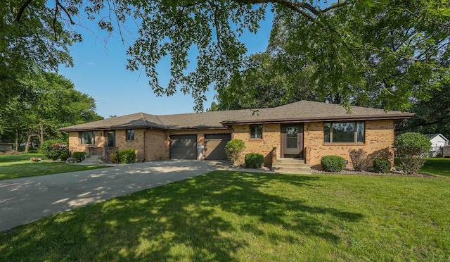 400-02 S Washington St, Braidwood, IL 60408 - single story home featuring brick siding, a garage, concrete driveway, and a front yard