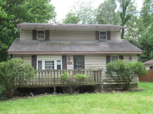 2238 Oakwood Ave, Danville, IL 61832 - rear view of house featuring a wooden deck and a yard