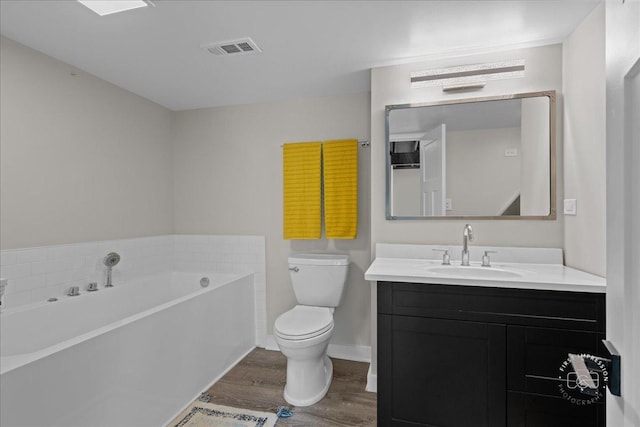 340 Hamilton Rd, Saint Charles, IL 60175 - bathroom with wood finished floors, a bath, and vanity