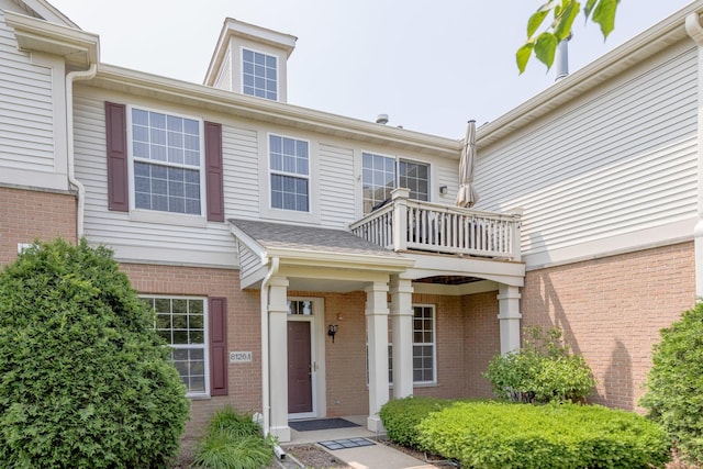 8126 Concord Ln Unit A, Justice, IL 60458 - doorway to property featuring a balcony and brick siding