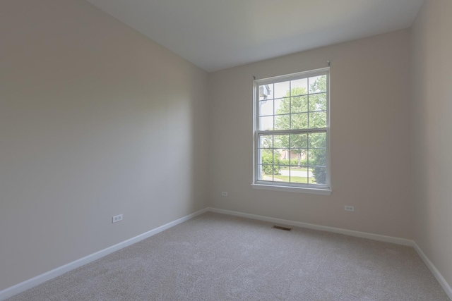 8126 Concord Ln Unit A, Justice, IL 60458 - empty room with healthy amount of natural light and light carpet