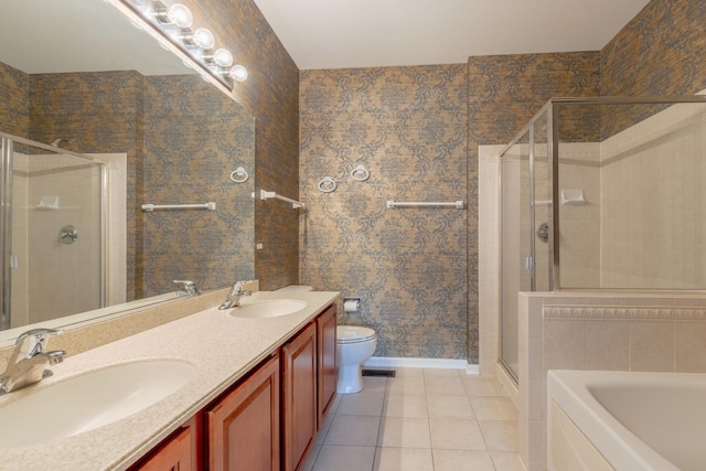 8126 Concord Ln Unit A, Justice, IL 60458 - full bath featuring a shower stall, tile patterned flooring, double vanity, a garden tub, and wallpapered walls