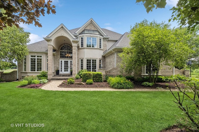 2 E Prairie Ct, Hawthorn Woods, IL 60047 - view of front of property with a front yard, stucco siding, and roof with shingles