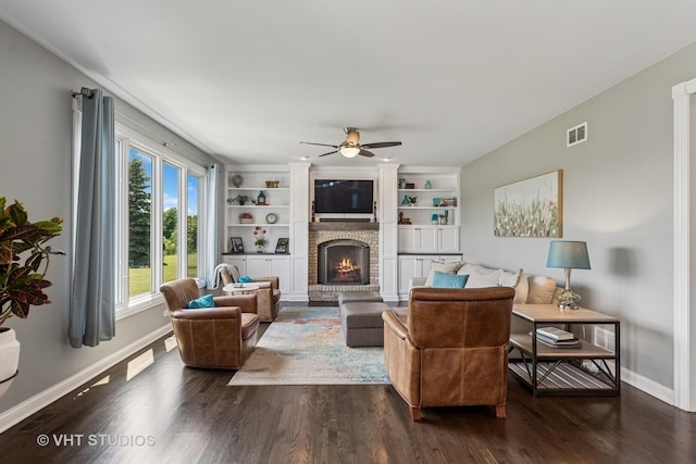 2 E Prairie Ct, Hawthorn Woods, IL 60047 - living area featuring a ceiling fan, a fireplace, dark wood-style flooring, and built in shelves