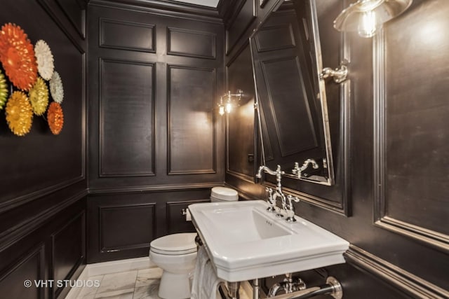 2 E Prairie Ct, Hawthorn Woods, IL 60047 - bathroom with a decorative wall and marble look tile flooring