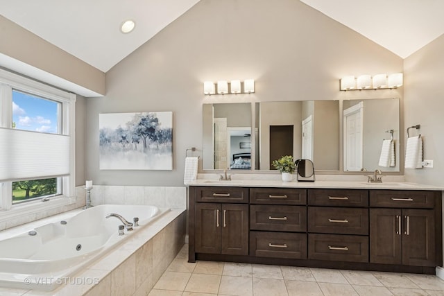 2 E Prairie Ct, Hawthorn Woods, IL 60047 - bathroom featuring double vanity, high vaulted ceiling, a whirlpool tub, and healthy amount of natural light