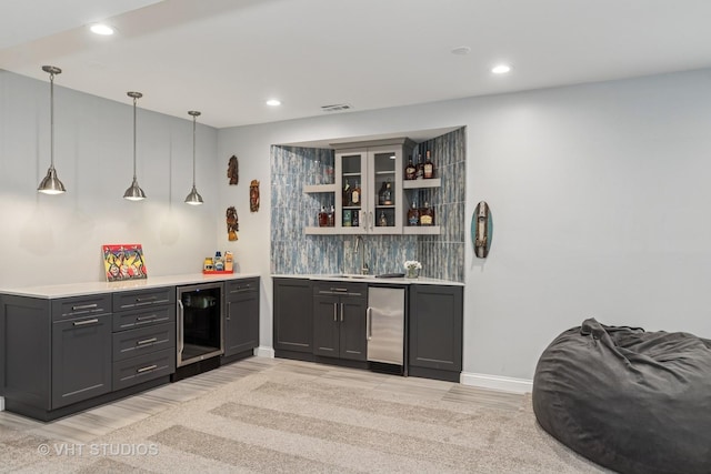 2 E Prairie Ct, Hawthorn Woods, IL 60047 - indoor wet bar featuring wine cooler, refrigerator, backsplash, light wood-style flooring, and recessed lighting