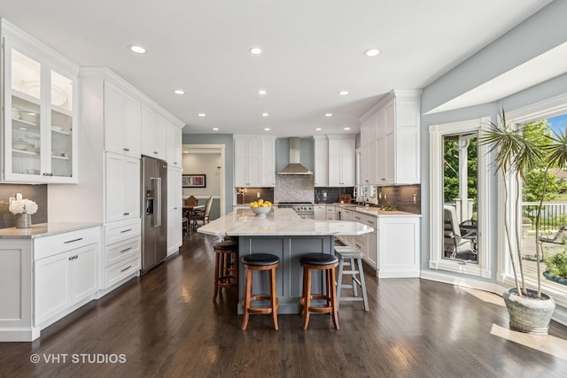 2 E Prairie Ct, Hawthorn Woods, IL 60047 - kitchen with wall chimney range hood, stainless steel appliances, a kitchen island, white cabinetry, and recessed lighting