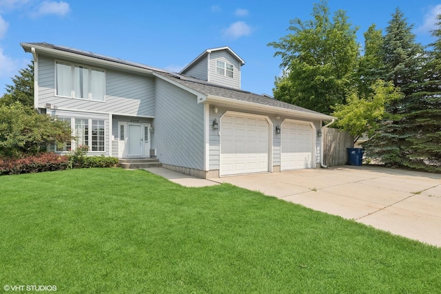 2215 Yeoman St, Waukegan, IL 60087 - view of front of home with an attached garage, driveway, and a shingled roof