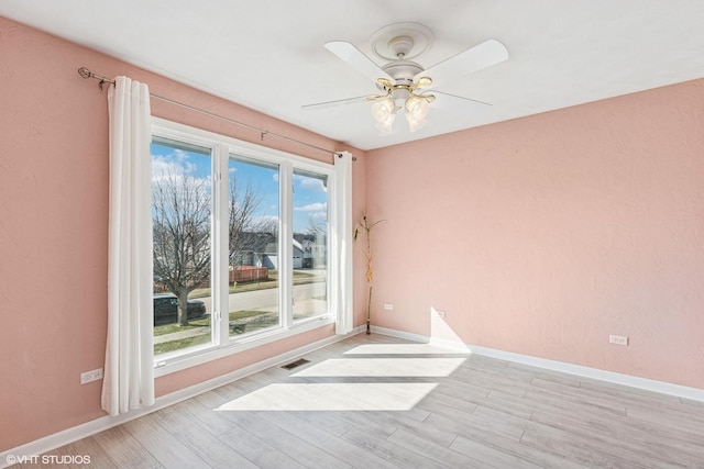 2215 Yeoman St, Waukegan, IL 60087 - empty room featuring light wood-style flooring and a ceiling fan