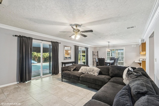 2215 Yeoman St, Waukegan, IL 60087 - living area featuring light tile patterned flooring, a ceiling fan, ornamental molding, and a textured ceiling