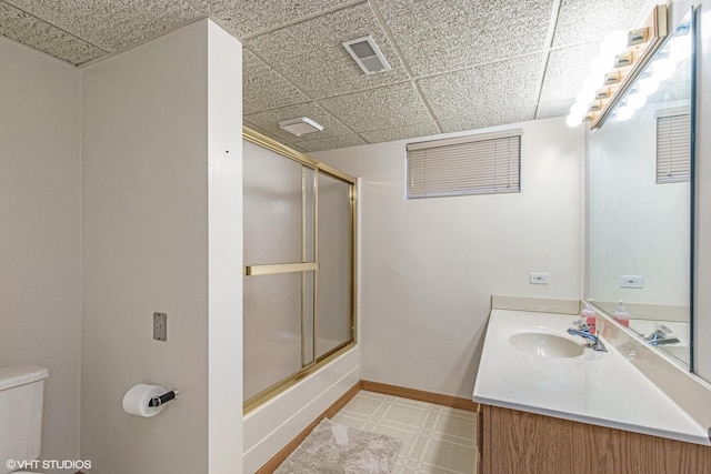 2215 Yeoman St, Waukegan, IL 60087 - bathroom featuring vanity, a drop ceiling, and shower / bath combination with glass door
