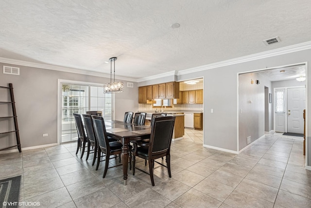 2215 Yeoman St, Waukegan, IL 60087 - dining room featuring light tile patterned flooring, crown molding, a chandelier, and a textured ceiling