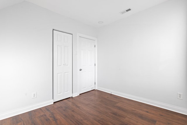 6920 S Laflin St, Chicago, IL 60636 - unfurnished bedroom with dark wood-style flooring and a closet