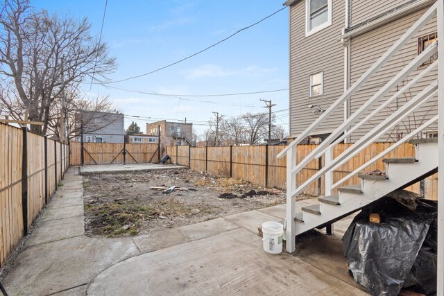 6920 S Laflin St, Chicago, IL 60636 - fenced backyard featuring stairway and a patio area