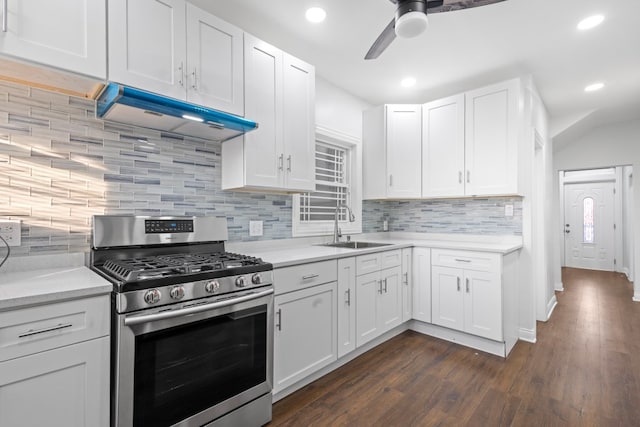 6920 S Laflin St, Chicago, IL 60636 - kitchen with gas stove, under cabinet range hood, a ceiling fan, white cabinetry, and recessed lighting