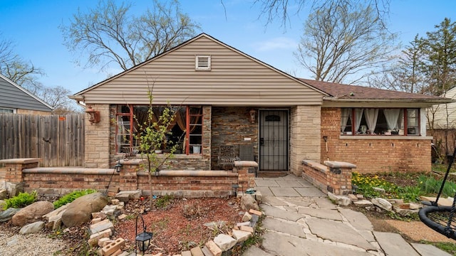 36 Monee Rd, Park Forest, IL 60466 - bungalow featuring a porch and brick siding