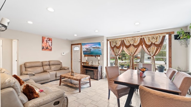 36 Monee Rd, Park Forest, IL 60466 - living room featuring recessed lighting, light stone finish flooring, and a fireplace