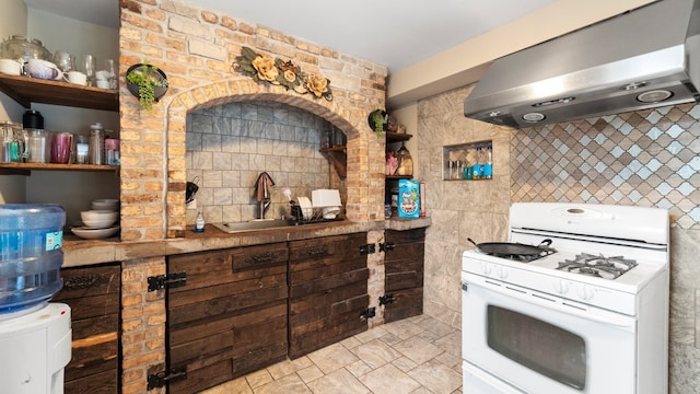 36 Monee Rd, Park Forest, IL 60466 - kitchen featuring gas range gas stove, wall chimney range hood, open shelves, and tasteful backsplash