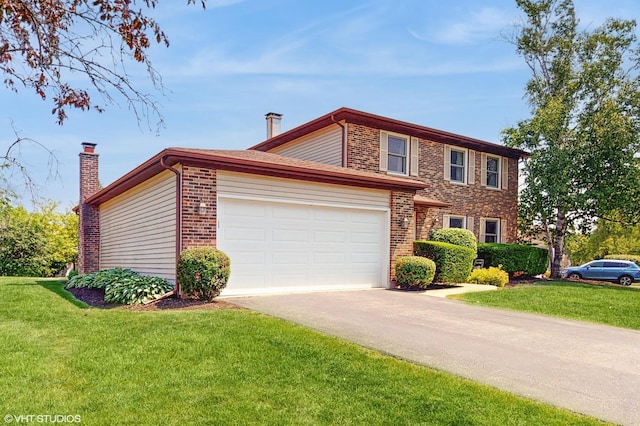 4265 Portage Ln, Hoffman Estates, IL 60192 - view of front of house with asphalt driveway, brick siding, and a front lawn