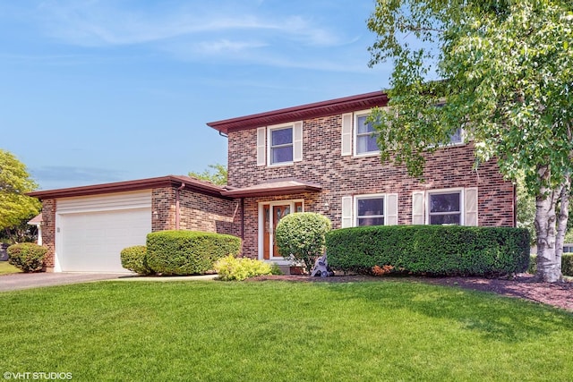 4265 Portage Ln, Hoffman Estates, IL 60192 - view of front of house featuring brick siding, driveway, a front yard, and a garage