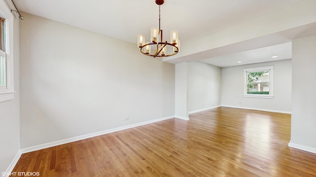 4265 Portage Ln, Hoffman Estates, IL 60192 - spare room with light wood-style flooring and a chandelier