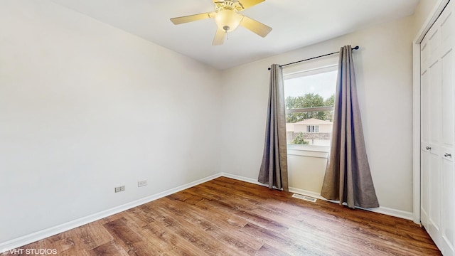 4265 Portage Ln, Hoffman Estates, IL 60192 - empty room with wood finished floors and a ceiling fan