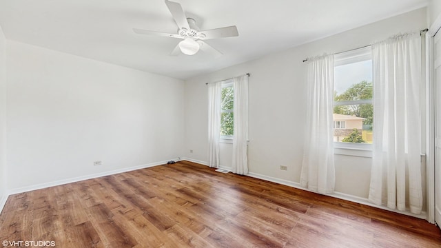 4265 Portage Ln, Hoffman Estates, IL 60192 - spare room featuring wood finished floors and ceiling fan