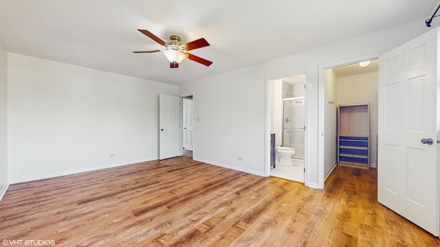 4265 Portage Ln, Hoffman Estates, IL 60192 - unfurnished bedroom with light wood-type flooring, ensuite bath, and a ceiling fan