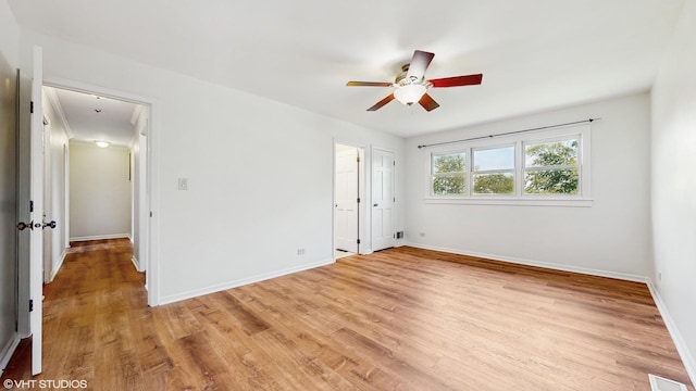 4265 Portage Ln, Hoffman Estates, IL 60192 - spare room featuring ceiling fan and light wood-style floors