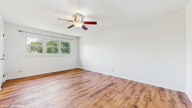 4265 Portage Ln, Hoffman Estates, IL 60192 - empty room with a ceiling fan and light wood finished floors