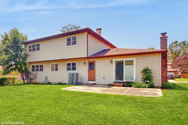 4265 Portage Ln, Hoffman Estates, IL 60192 - rear view of property featuring a lawn, a chimney, and a patio area
