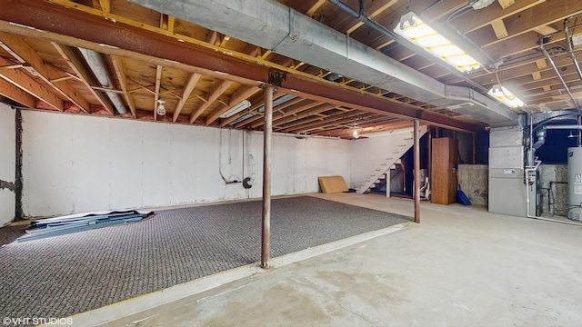 4265 Portage Ln, Hoffman Estates, IL 60192 - unfinished basement featuring stairs and water heater