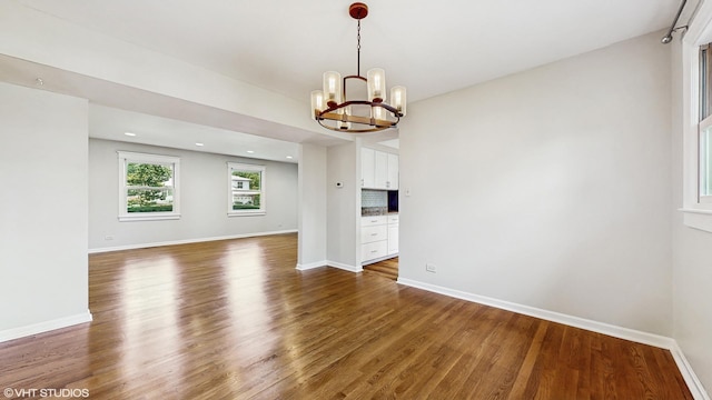 4265 Portage Ln, Hoffman Estates, IL 60192 - empty room featuring a chandelier, wood finished floors, and recessed lighting