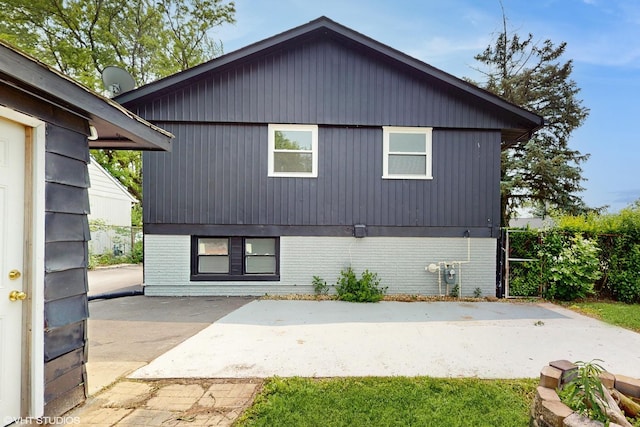 22201 Windsor Ct, Richton Park, IL 60471 - rear view of house with brick siding and a patio area