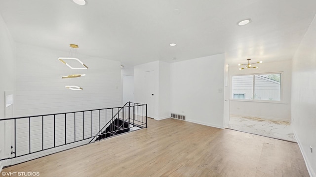 22201 Windsor Ct, Richton Park, IL 60471 - unfurnished room with wood finished floors, a chandelier, and recessed lighting